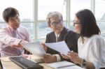 Business Team Work Meeting Interview And Explaining Project Solution Discussing, On Table Meeting Scene Stock Photo