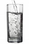 Water Pouring Into A Tall Glass, Closeup View, Isolated On White Stock Photo