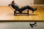 Man Lying On Chaise Longue Stock Photo