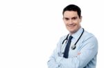 Male Surgeon Posing With Folded Arms Stock Photo