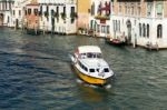 Motorboat Cruising Down The Grand Canal In Venice Stock Photo