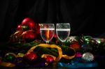 Two Glasses Of Champagne With A Christmas Decor In The Background Stock Photo