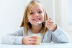 Beautiful Child Having Breakfast At Home Stock Photo