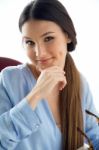 Beautiful Young Woman Looking At Camera At Home Stock Photo