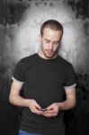 Young male reading sms Stock Photo