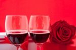 St Valentine's Setting With Present And Red Wine Stock Photo