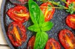 Baked Cherry Tomatoes With Basil And Thyme Stock Photo