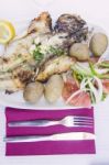 Grilled Fish With Tomato Salad And Potatoes Stock Photo