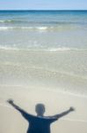 Shadow Man On Beach Stock Photo