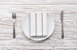 Empty Plate Napkin Fork Knife Silverware White Wooden Table Background Stock Photo