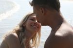 Smiling romantic Couple At Beach Stock Photo