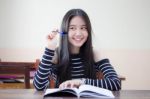 Portrait Of Thai Teen Beautiful Girl Writing Book Stock Photo