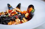  Squid Ink Pasta With King Prawns Stock Photo