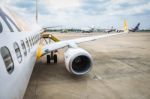 Wing Of Airplane Turbine Detail On Airport In Field Standby Or Wait Passenger. View From The Top Stock Photo