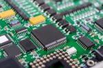 Circuit Board With Electronic Components Background Stock Photo