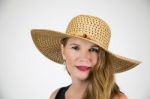 Mature Blonde Female In Large Hat Smiling And Looking At Camera Stock Photo