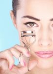 Woman Holding Tool For Eyelash Stock Photo