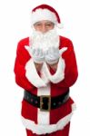 Male Santa Posing With Open Palms Stock Photo