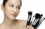 Portrait Of The Beautiful Woman With Make-up Brushes Stock Photo