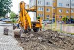 Construction Of A New Road. Excavator Prepares The Surface Stock Photo