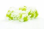 Green Coconut Muchkins On White Floor Stock Photo