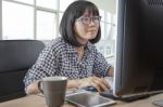 45s Years Woman Working In Front Of Computer Monitor Office Life Theme Stock Photo