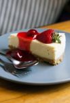 Strawberry Cheesecake With Spoon And Fork Stock Photo