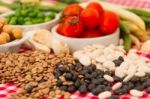 Variety Of Kitchen Ingredients With Fresh And Dried Legumes Stock Photo