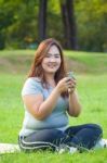 Happy Fat Woman Using Mobile Phone Stock Photo