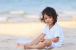 Asian Boy Play On Beach Stock Photo