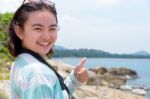 Young Woman Photography Near The Sea Stock Photo