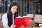 Asia Thai High School Student Uniform Beautiful Girl Read A Book Stock Photo