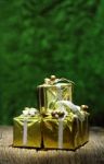 Gift Box On Old Wooden With Green Bokeh Background Stock Photo