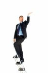 Businessman On Ladder Stock Photo