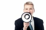 Businessman Posing With Bullhorn Stock Photo