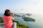 Woman On Peak Take Photos Stock Photo