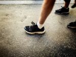 People Walking On A Walkside Stock Photo