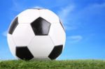 Stitch Leather Soccer Ball On Field Blur Blue Sky Stock Photo