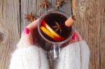 Mulled Wine And Spices On Weathered Wooden Table Stock Photo