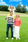 Smiling Family In Outdoors Stock Photo