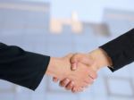 Handshaking Business People Stock Photo