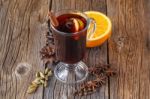 Mulled Wine And Spices On Weathered Wooden Table Stock Photo