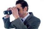 Man Looking Through Binoculars Stock Photo