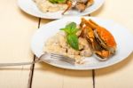 Italian Gnocchi With Seafood Sauce With Crab And Basil Stock Photo