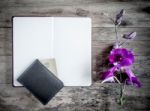 Open Book With A Purse And Credit Cards On A Wooden Background Stock Photo