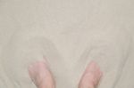 Feet In Sand Stock Photo