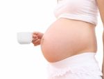 Coffee Cup Of Pregnant Woman On White Background Stock Photo