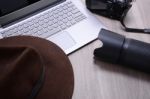 Closeup Of A Wooden Table With Laptop Stock Photo