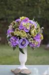 Beautiful Purple Flower Vase In The Garden Stock Photo