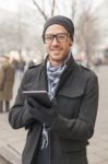 Man Holdin I-pad Tablet Computer On Street Stock Photo